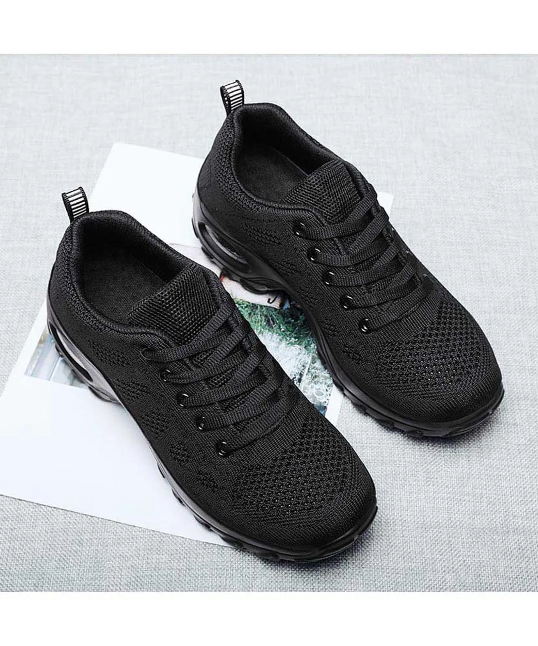 Black stripe sneaker with block heel and double rocker bottom.