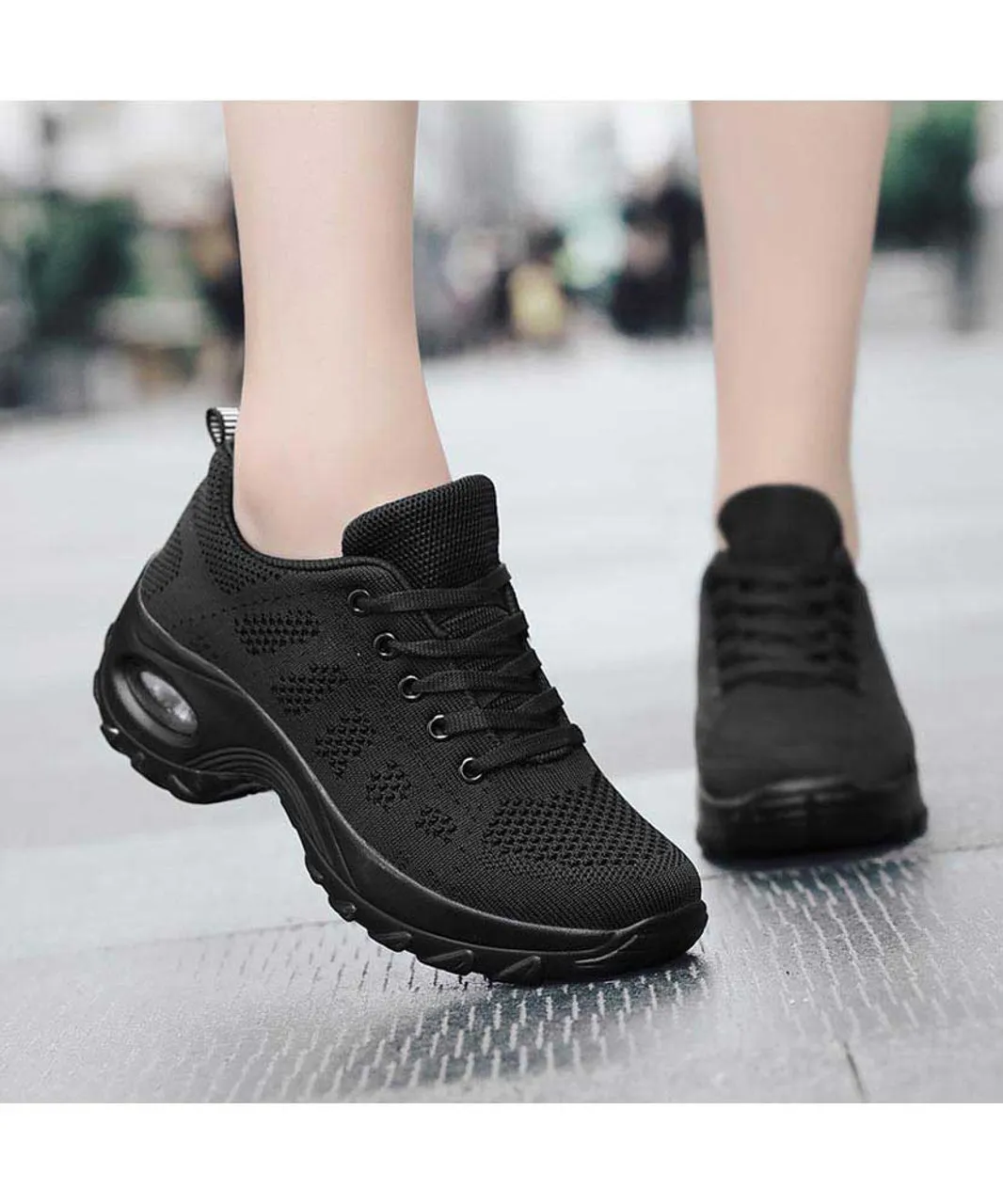 Black stripe sneaker with block heel and double rocker bottom.