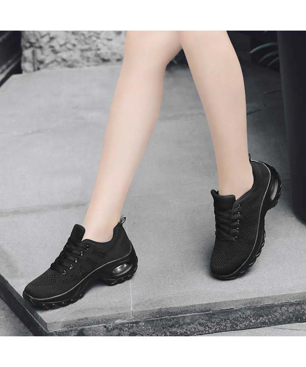 Black stripe sneaker with block heel and double rocker bottom.