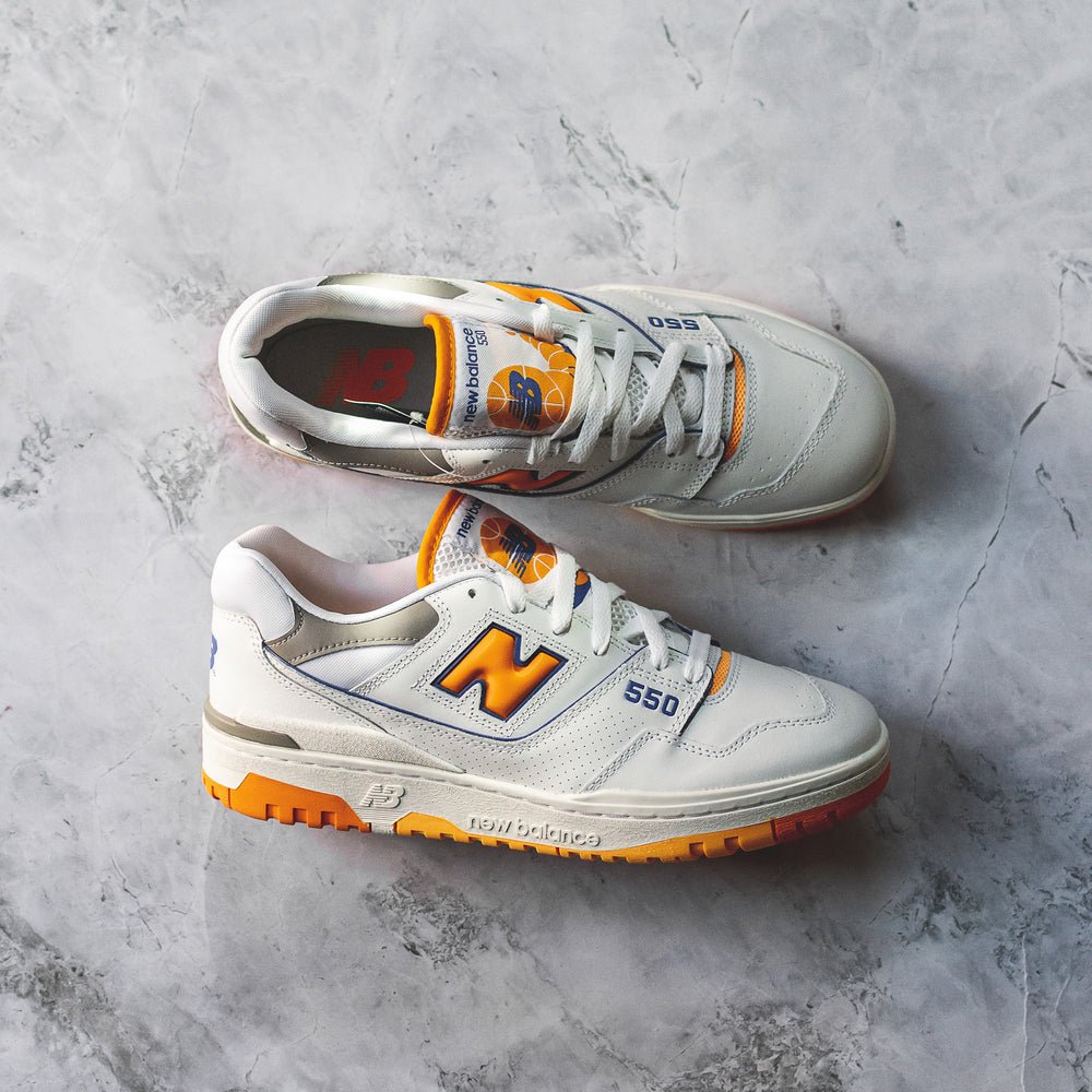 New Balance 550 White Sneakers with Vibrant Orange Details