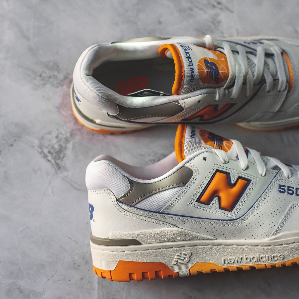 New Balance 550 White Sneakers with Vibrant Orange Details