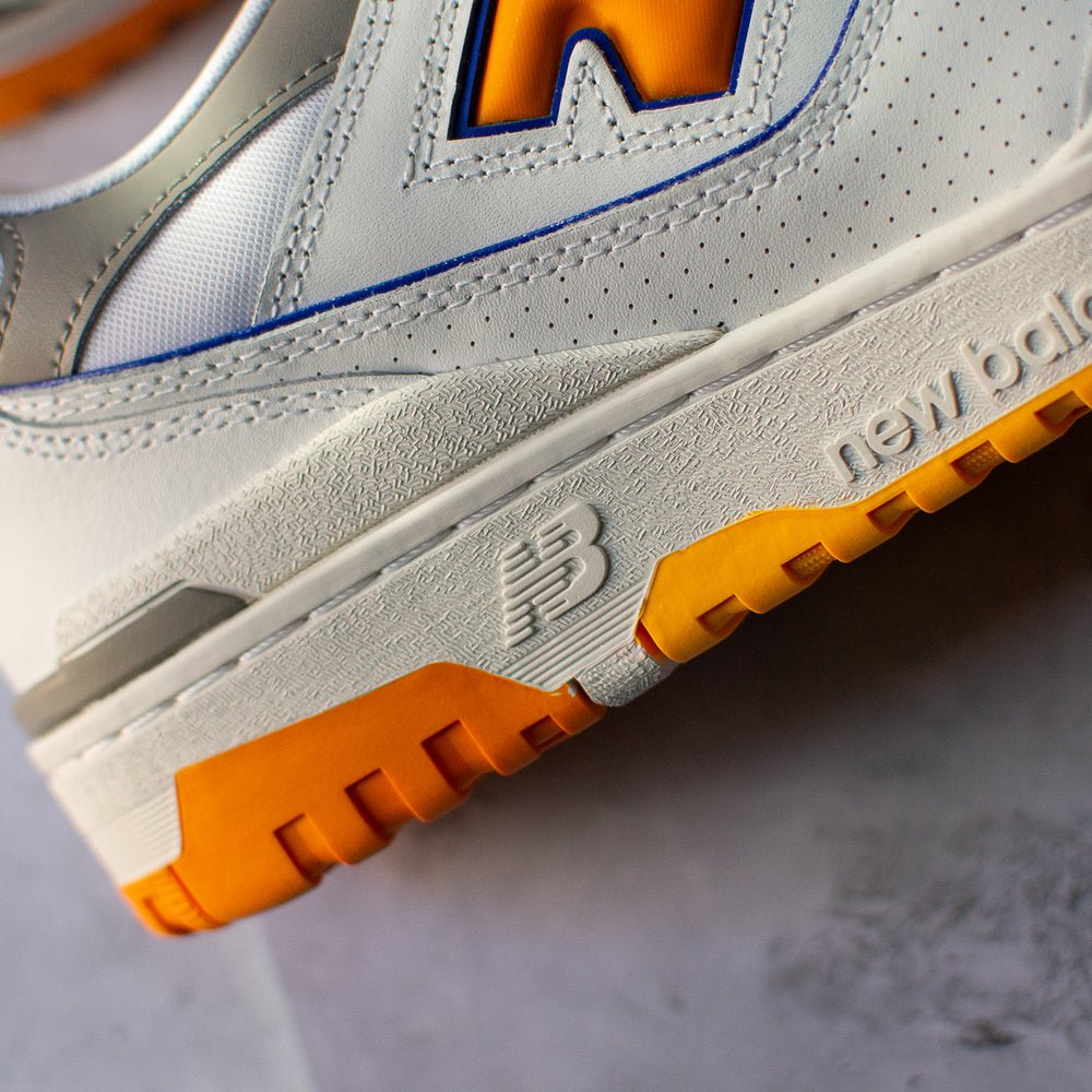 New Balance 550 White Sneakers with Vibrant Orange Details